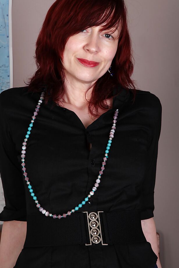 16P Redhead mature teacher undressing and exposing her goods in the classroom