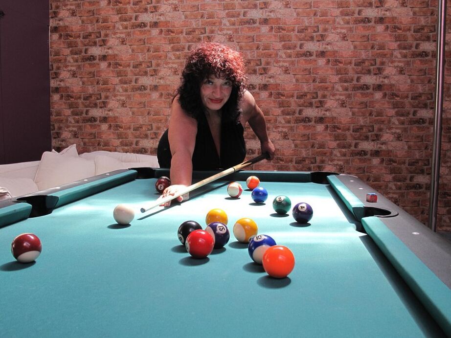 20P Busty older woman and two of her girlfriends blow a naked man on a pool table
