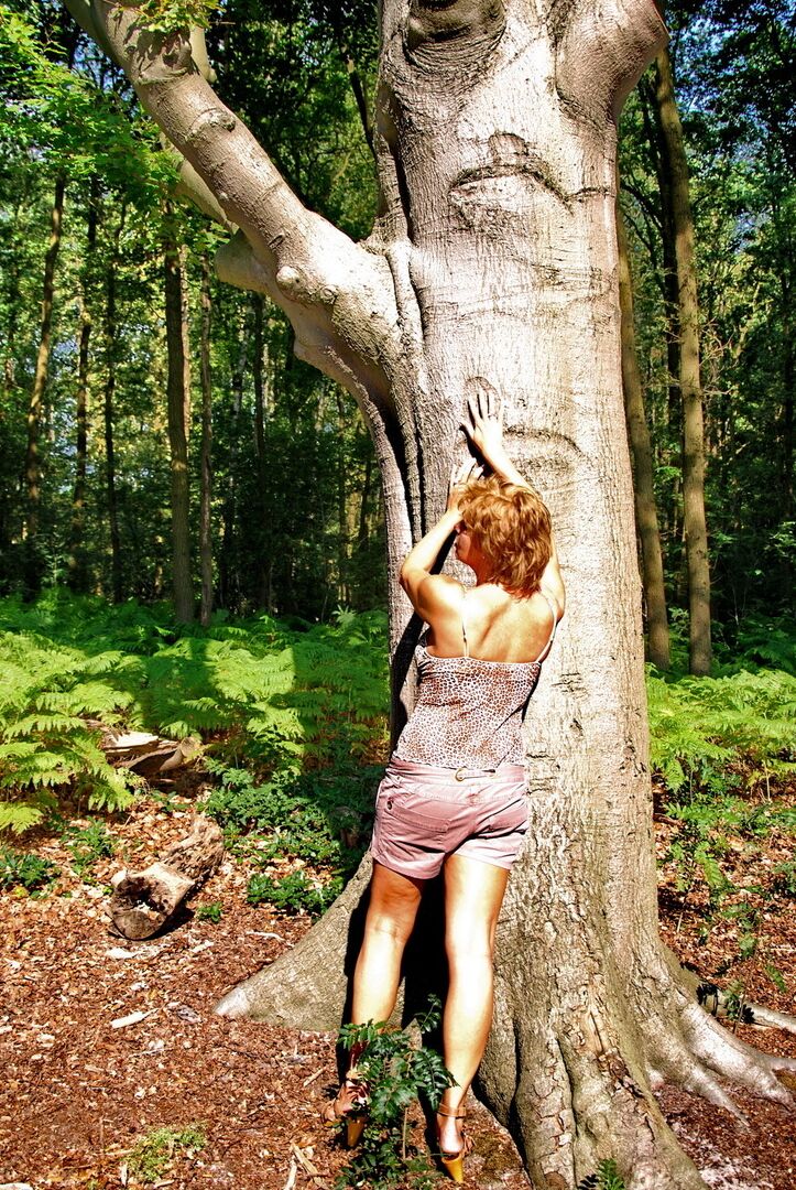 16P Older redhead uncovers her beautiful tits while in a forest