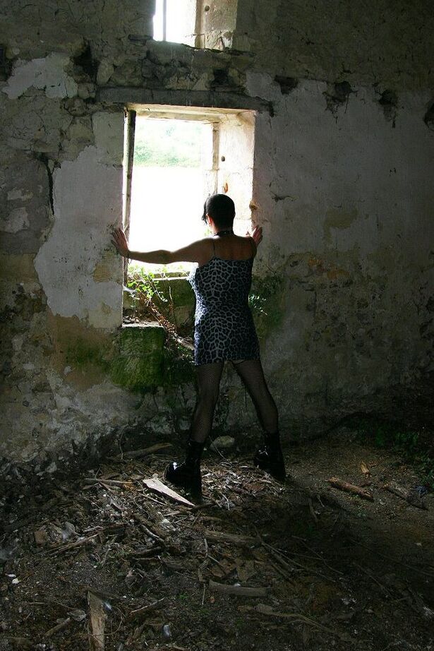 20P Mature BBW Mary Bitch takes a pee inside a root cellar in nylons and boots