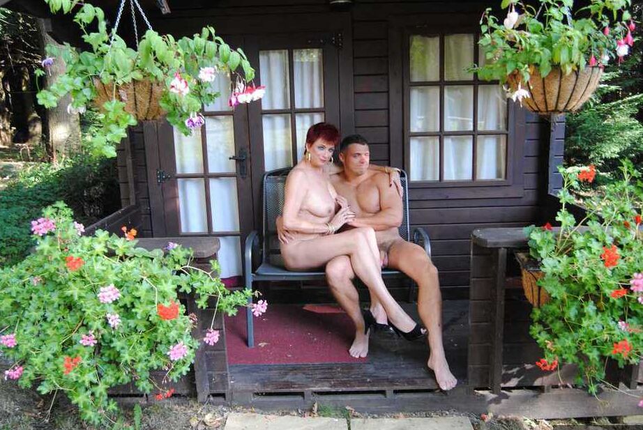 20P Mature redhead Dimonty gets pushed on a swing by her naked lover