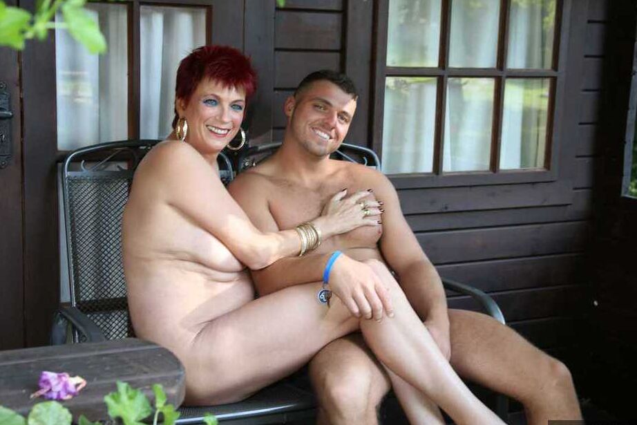 20P Mature redhead Dimonty gets pushed on a swing by her naked lover
