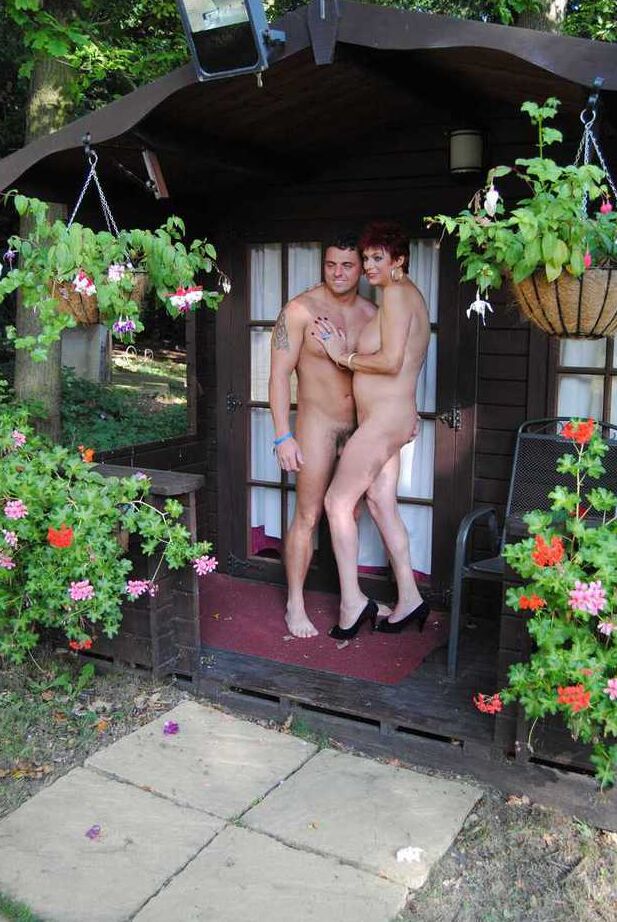 20P Mature redhead Dimonty gets pushed on a swing by her naked lover
