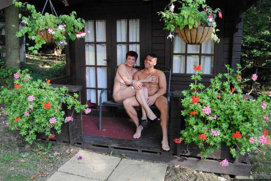 20P Mature redhead Dimonty gets pushed on a swing by her naked lover
