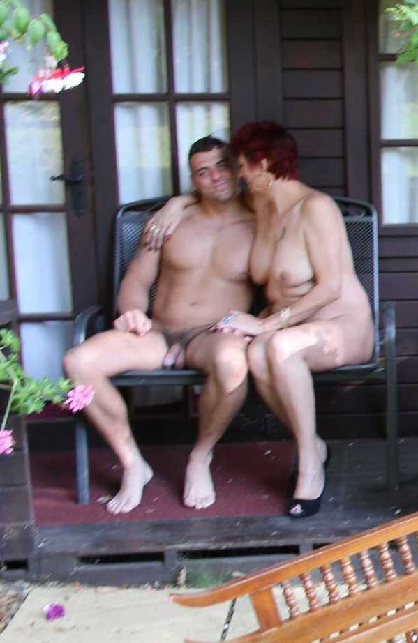 20P Mature redhead Dimonty gets pushed on a swing by her naked lover