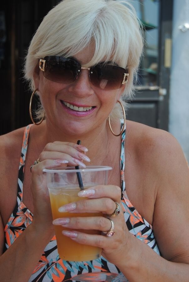 20P Short haired older lady Dimonty flashes no panty upskirts while out in public
