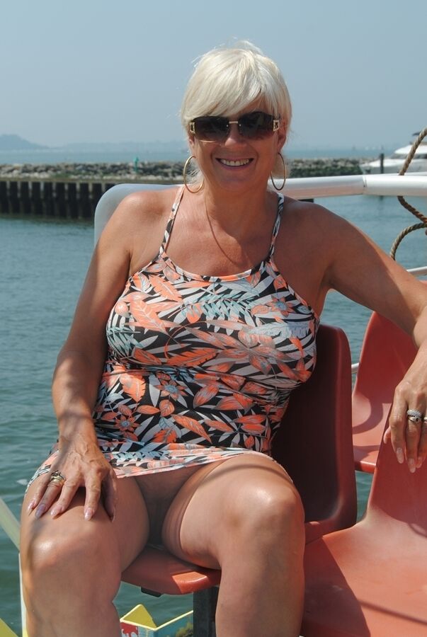 20P Short haired older lady Dimonty flashes no panty upskirts while out in public