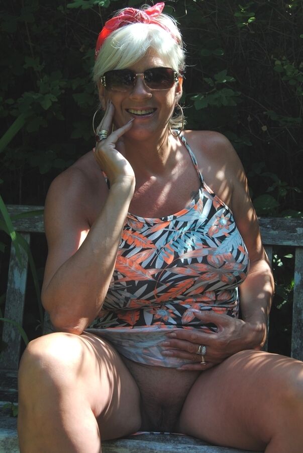 20P Short haired older lady Dimonty flashes no panty upskirts while out in public