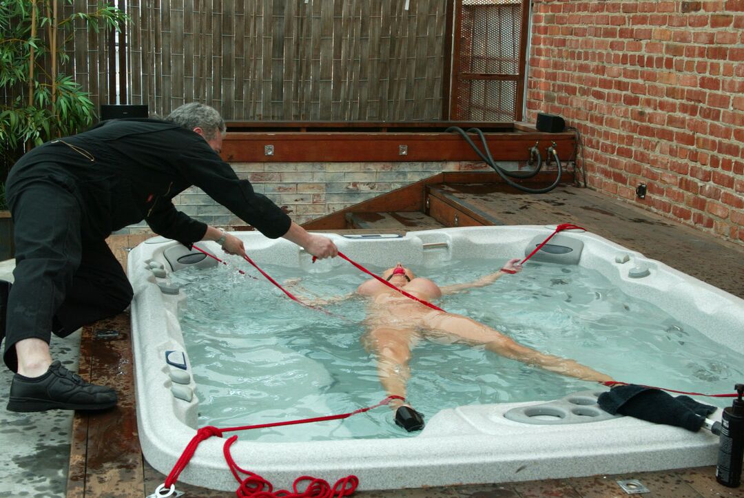 21P Hot Christina Carter reveal her juggs and gets tied up in an outdoor jacuzzi
