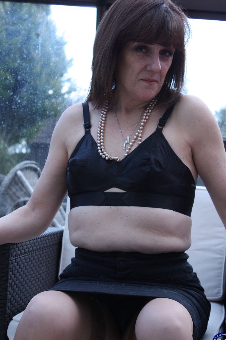 21P Mature vixen Pandora stripping to stockings and toying her pierced vagina