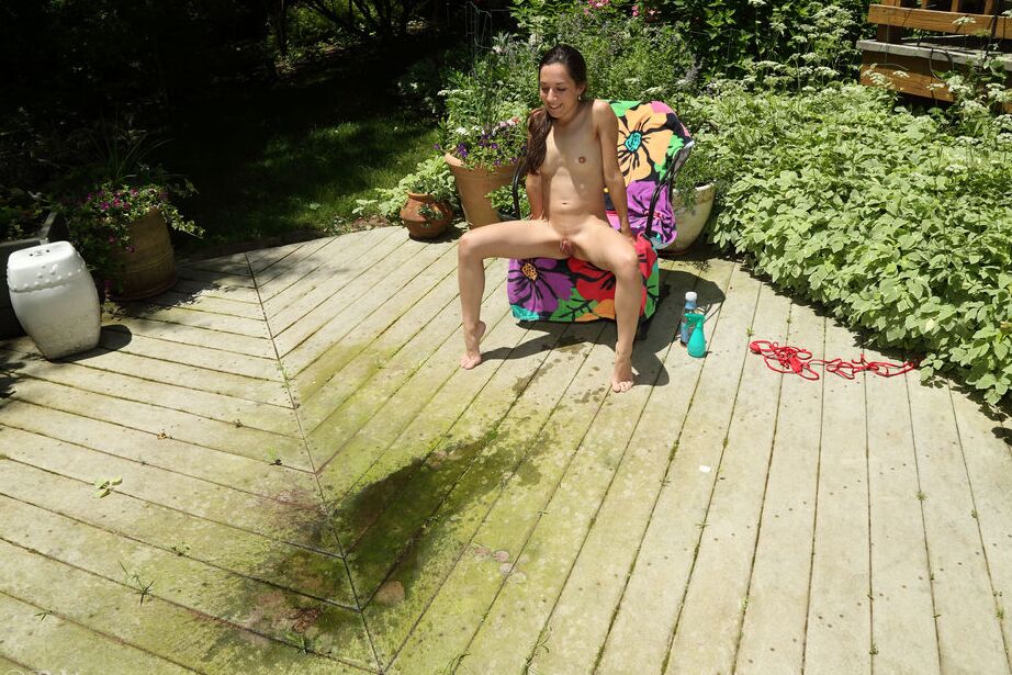 16P Thin teen girl Freya Von Doom takes a piss on the patio after fisting her twat