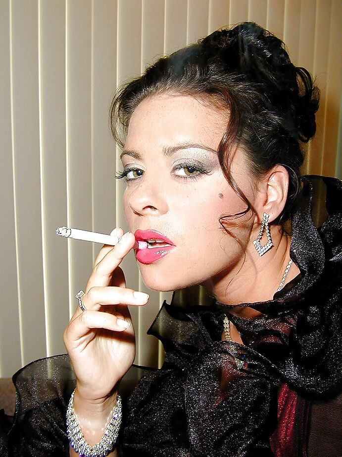 16P Busty stocking and lingerie clad MILF Linsey Dawn McKenzie having a smoke