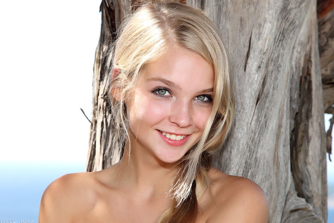 12P Gorgeous pretty face girl with perky breasts playing naked in the trees