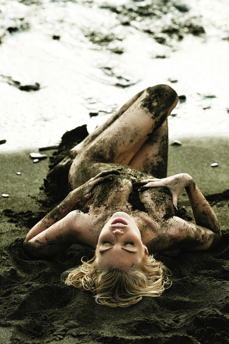 16P Hot centerfold Martina Zemanova rolls her cute body in mud during a nude shoot