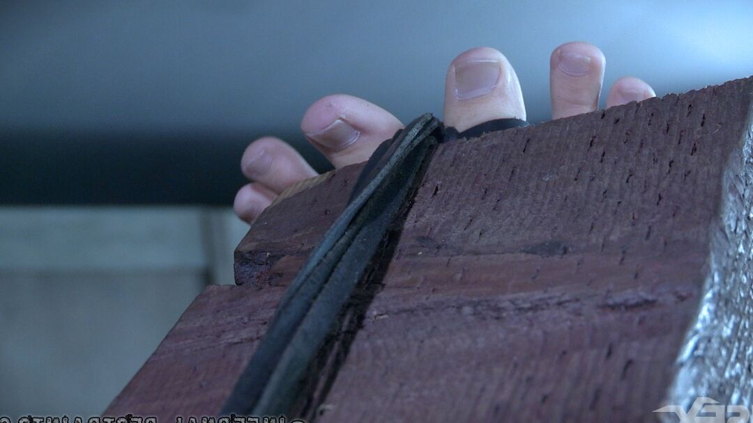 14P Caucasian redhead Kel Bowie is restrained and penetrated in a dungeon setting