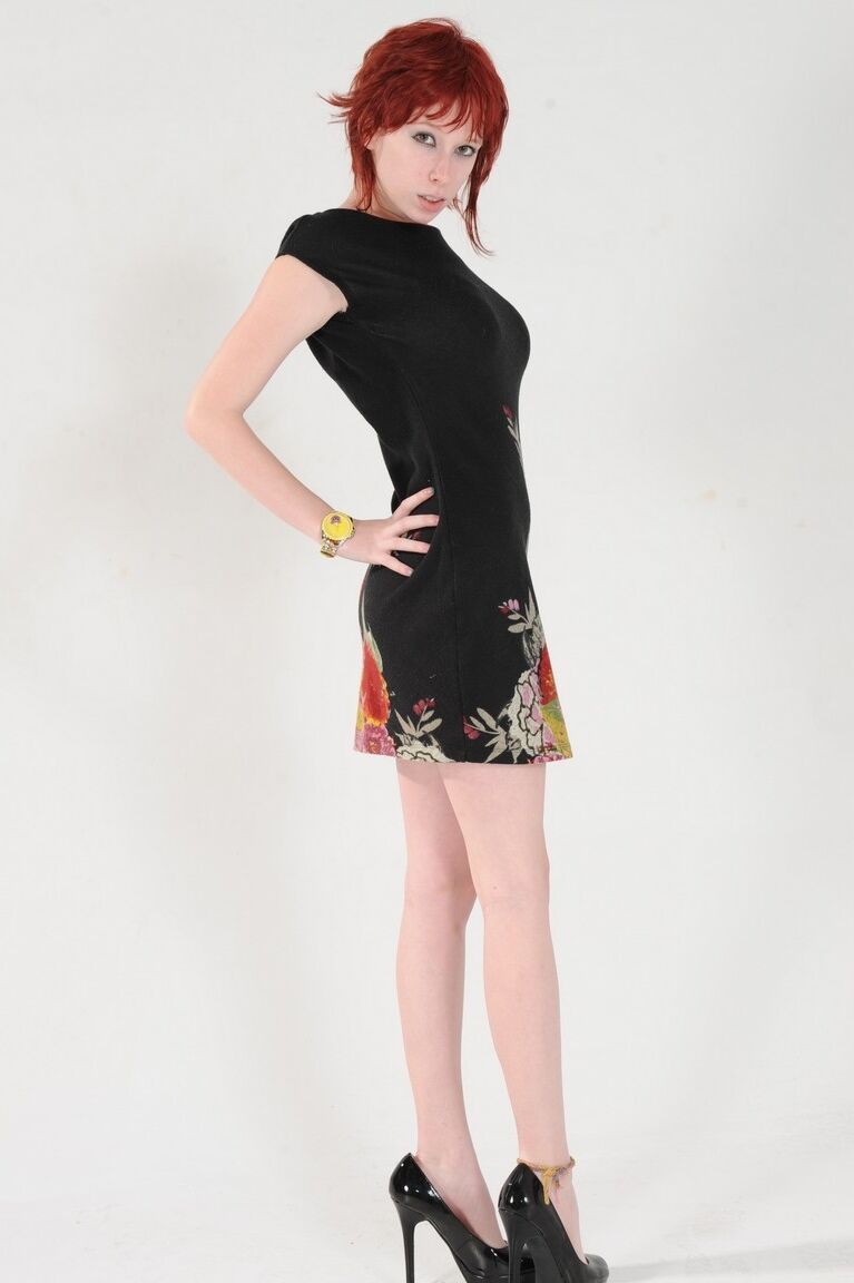 15P Hot redhead with long legs Zoey Nixon exposes her beautiful breasts
