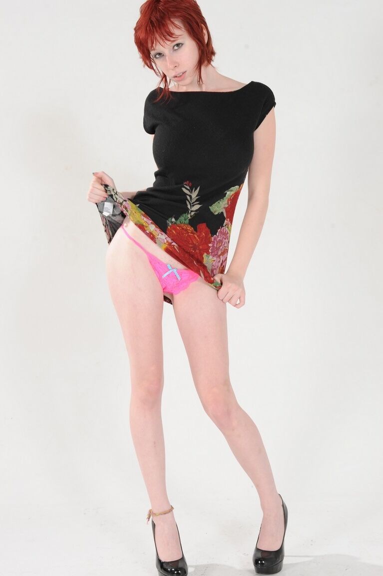 15P Hot redhead with long legs Zoey Nixon exposes her beautiful breasts