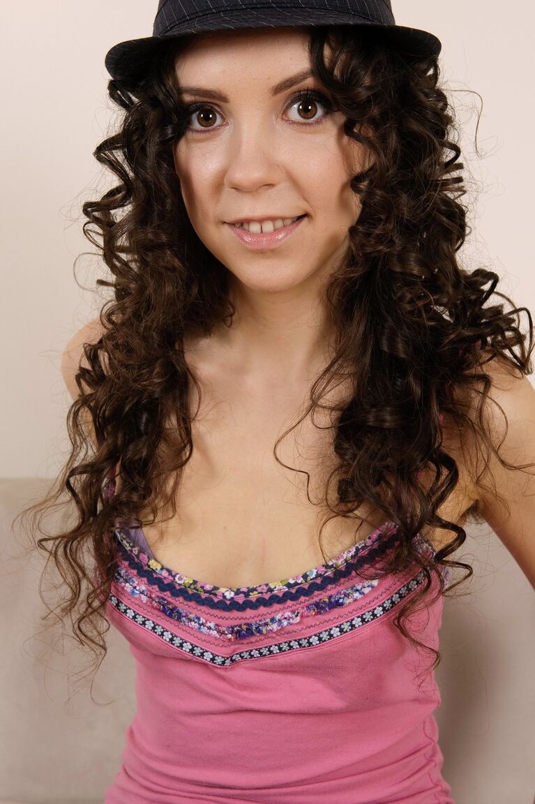21P Curly haired babe Lilly C reveals her hairy pussy and tiny tits in a solo