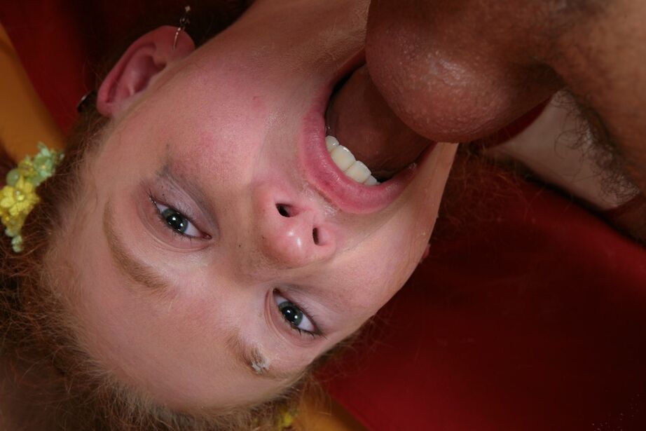 16P Young redhead has her mouth stretched wide open during a messy blowjob