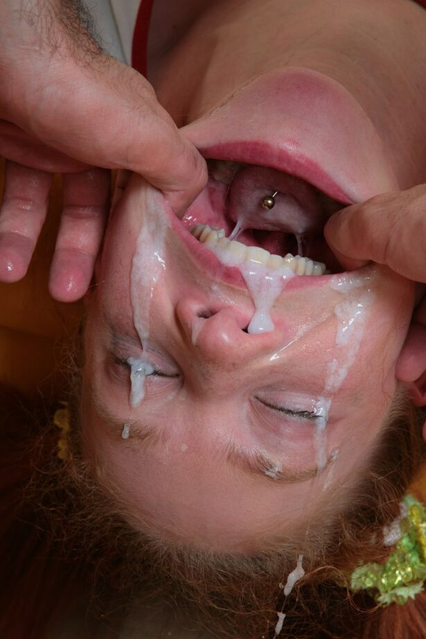 16P Young redhead has her mouth stretched wide open during a messy blowjob