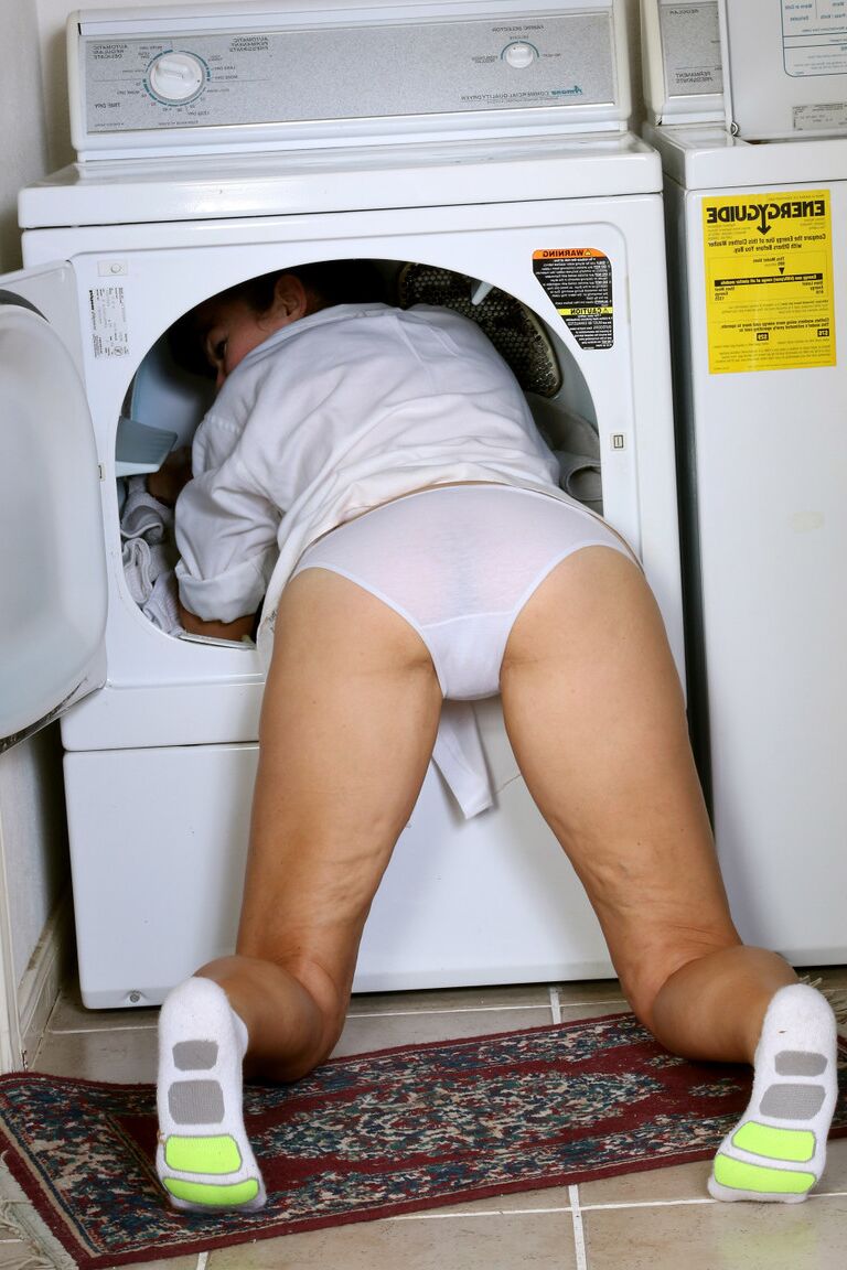 16P Mature lady with saggy tits Ivana Slew strips naked while doing laundry