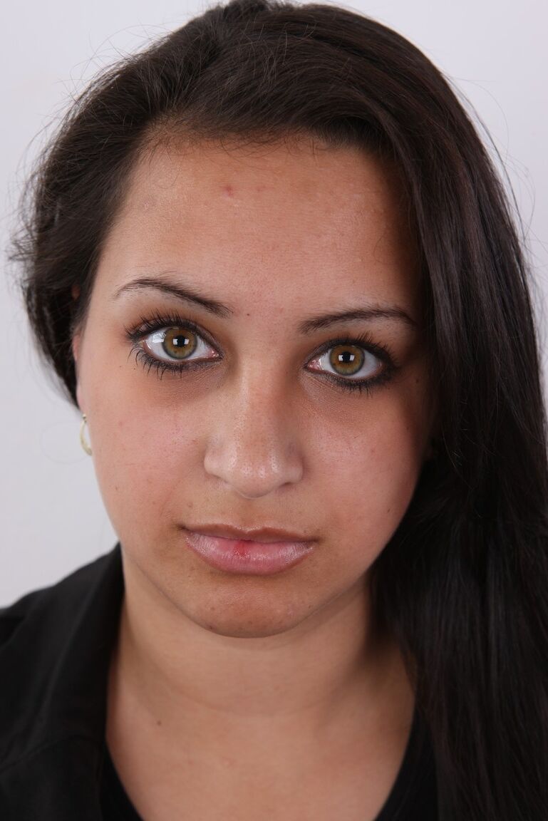 20P Chubby brunette Erika sits on a stool after getting completely naked