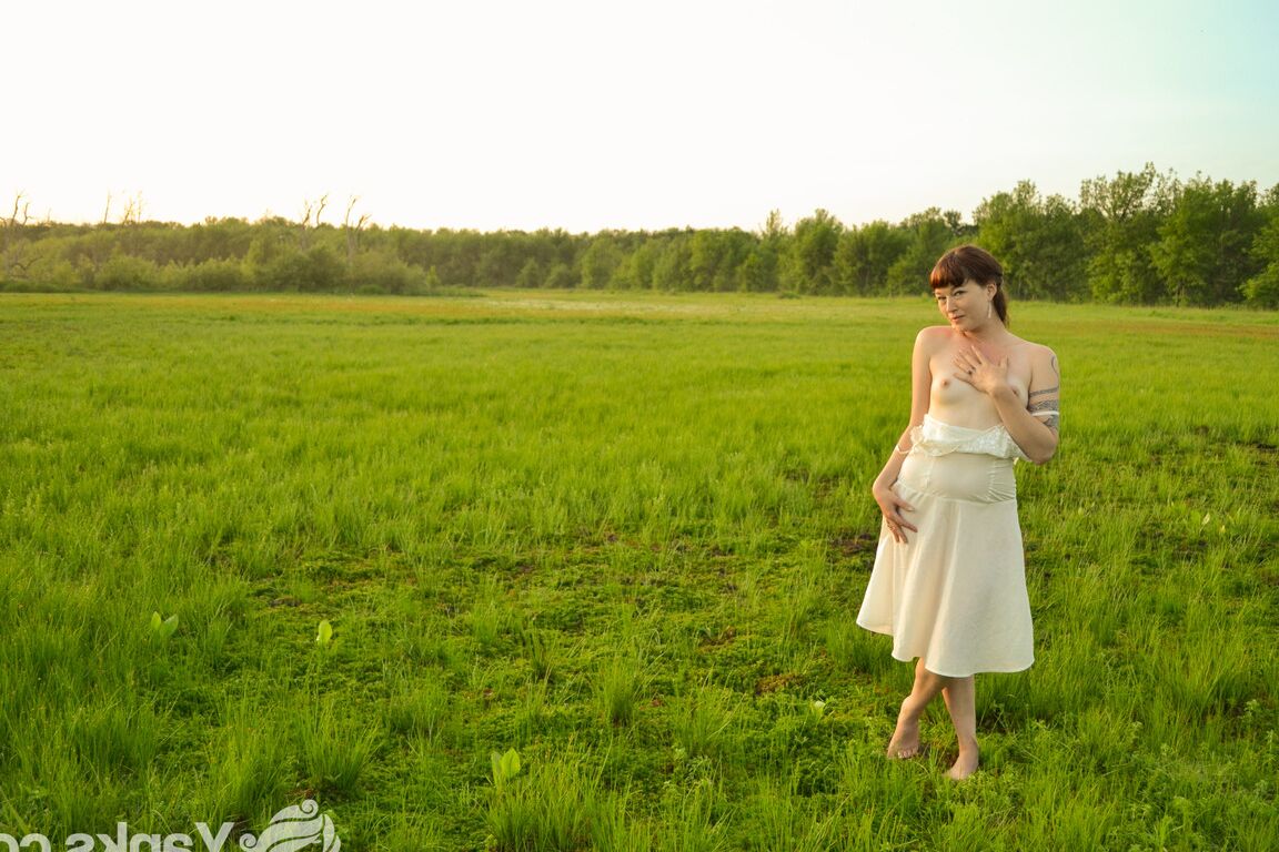 16P Natural redhead fondles her tits and pussy while naked in a field