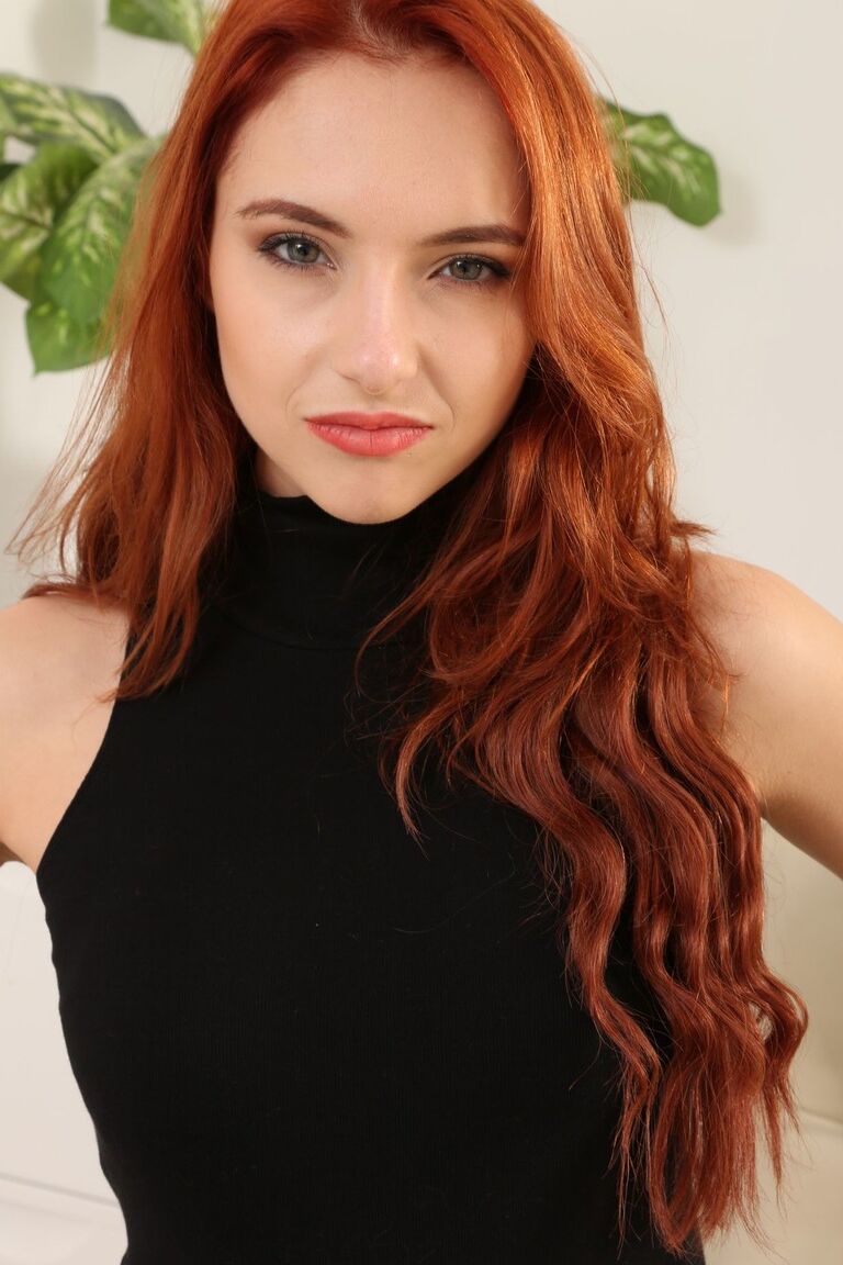21P Model with red wavy hair Sophia Blake undresses & poses in sheer tights