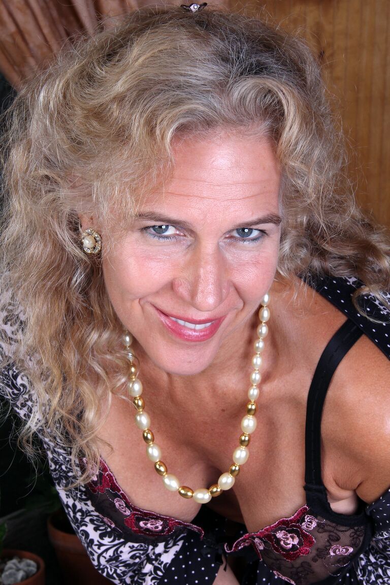21P Kinky mature Sabrina P shows her big juggs and rubs her clam in a solo