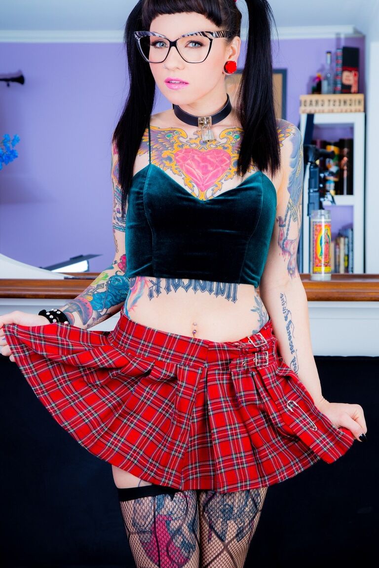 15P Tattooed Necro Nicki in pigtails & short skirt on knees showing tight ass
