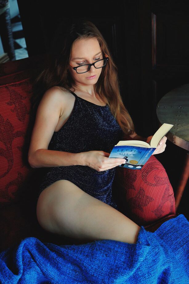 18P Nice teen Sofi Shane reads a book prior to showing her bush in the nude