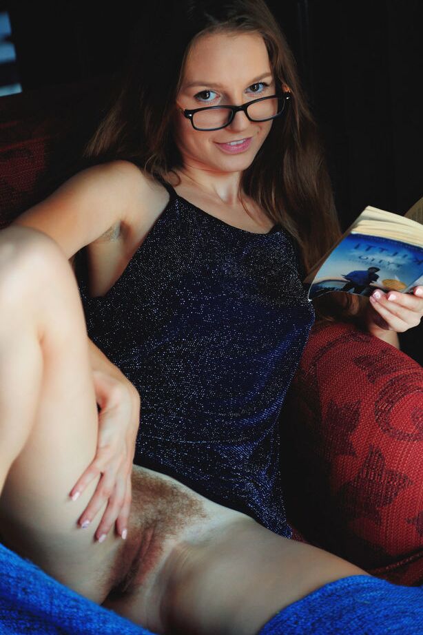 18P Nice teen Sofi Shane reads a book prior to showing her bush in the nude