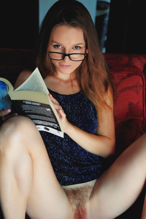 18P Nice teen Sofi Shane reads a book prior to showing her bush in the nude