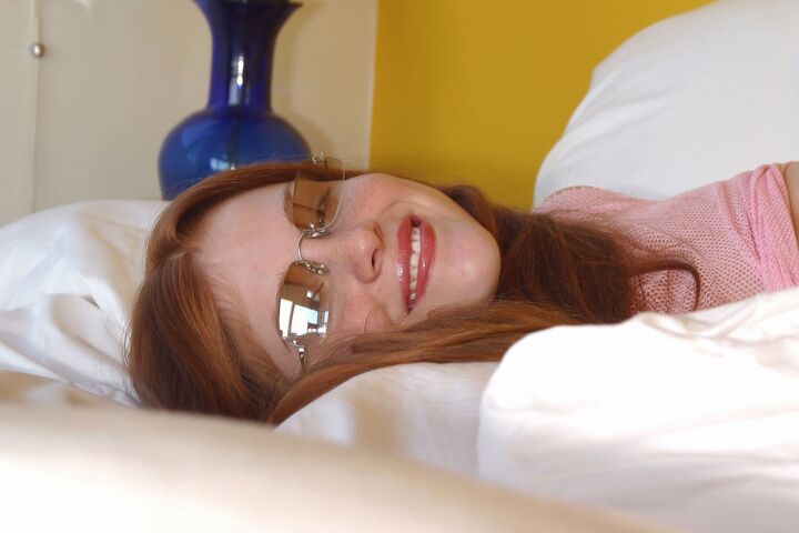 15P Nerdy redhead Tiffany Lance takes off her glasses and see thru clothing too