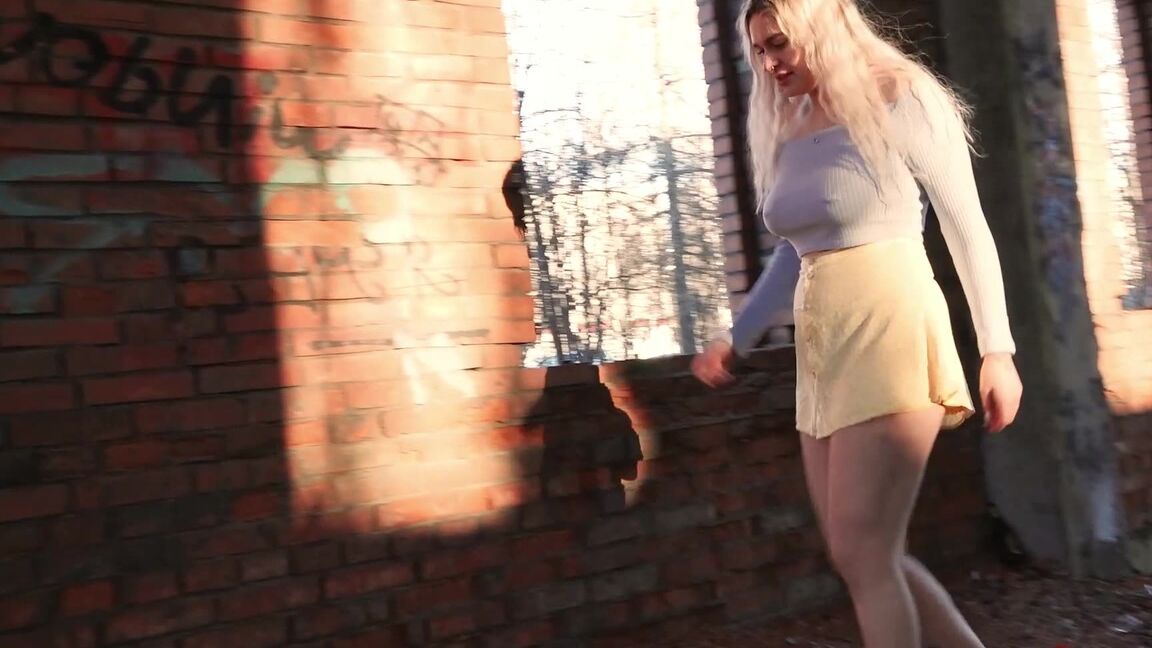 15P Blonde chick squats for a piss by an abandoned brick building