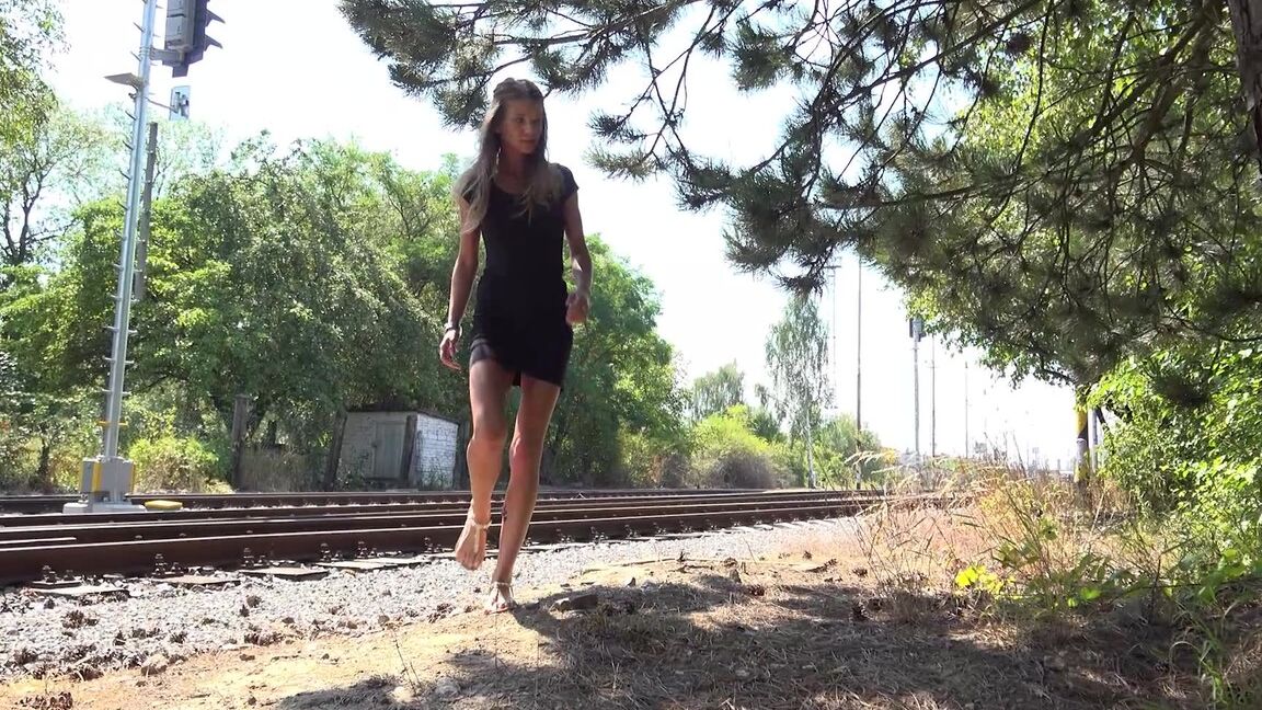 15P Sarah Key leans against a tree and pees
