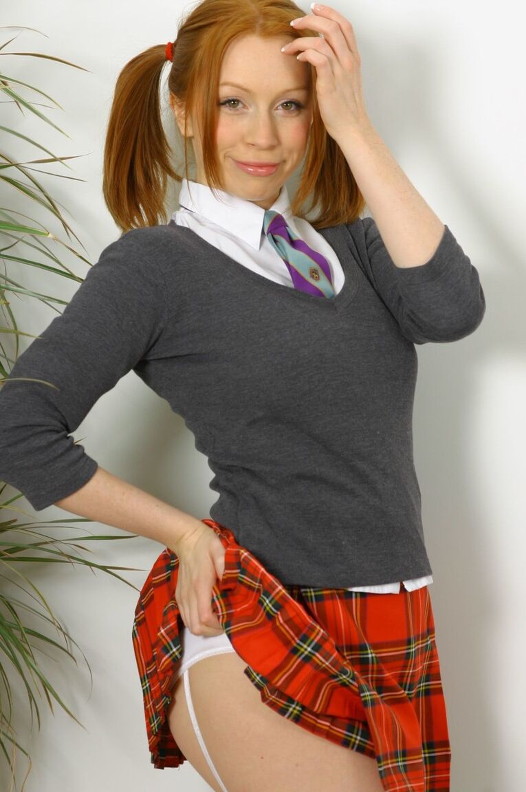 21P Pigtailed ginger Alexandra shows her hot tits as she strips & poses in panties