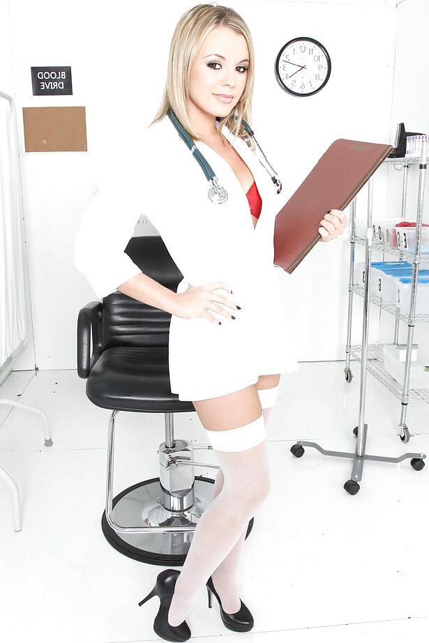16P Sexy nurse in uniform and white stockings Bree Olson strips and spreads