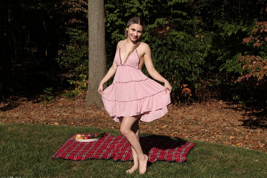 16P Caucasian teen Aria Amore masturbates with a banana and cucumber in a backyard