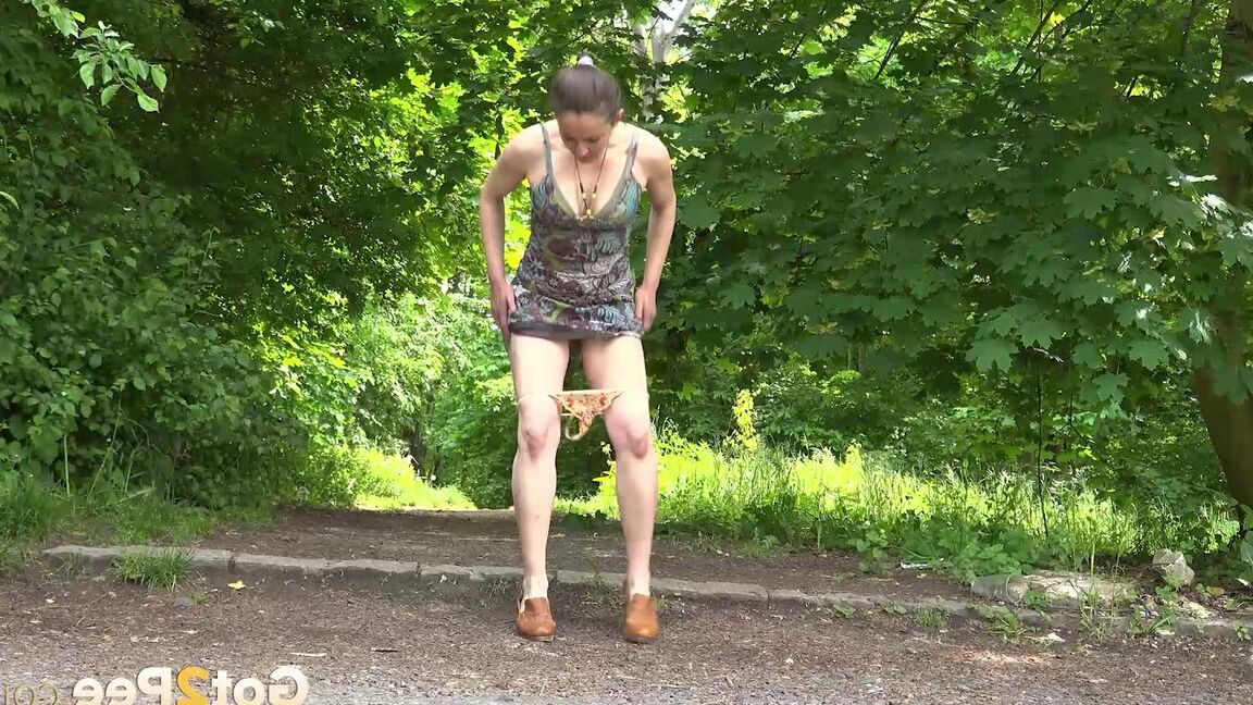 15P Caucasian chick Valentina Ross squats to pee in a parking lot near the woods
