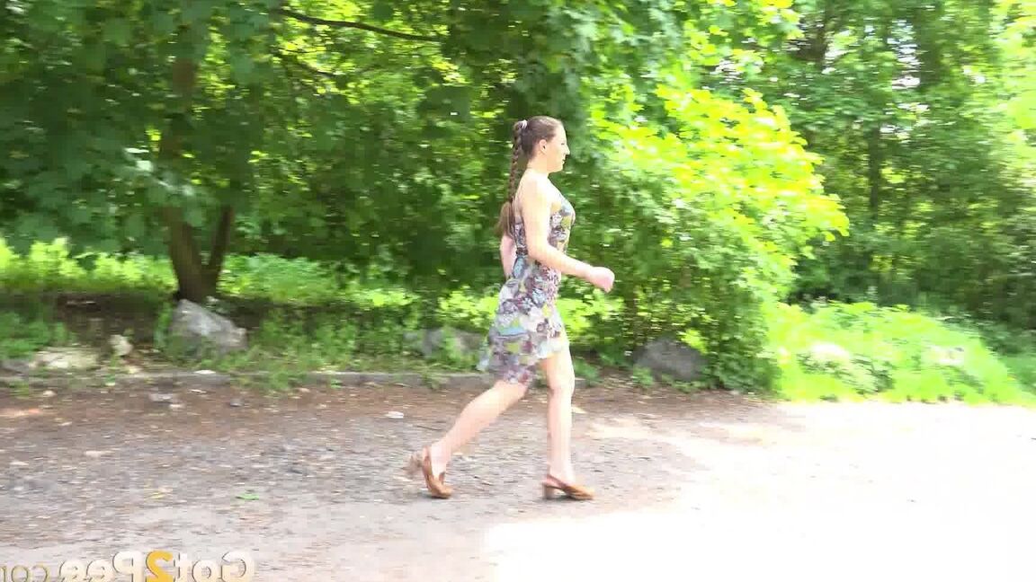 15P Caucasian chick Valentina Ross squats to pee in a parking lot near the woods