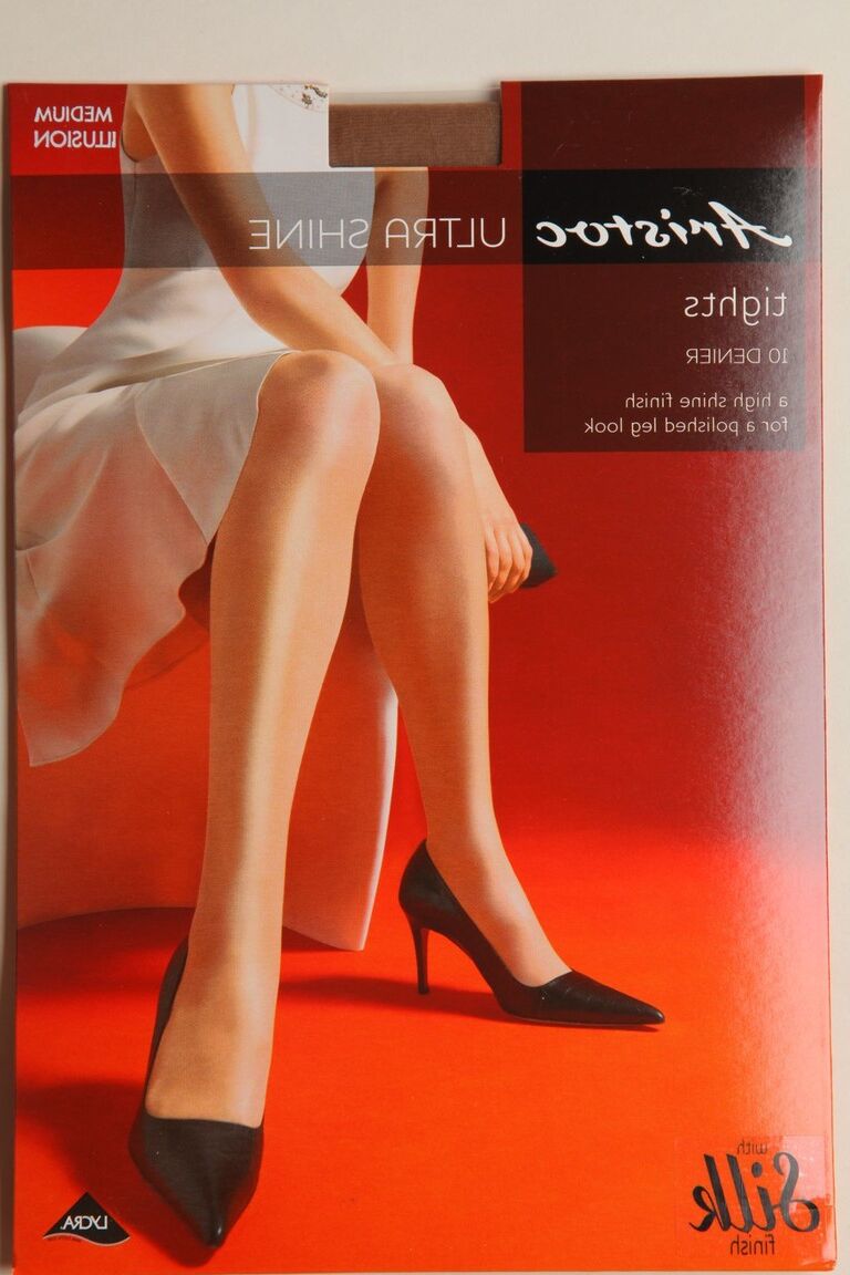 21P Glamorous ginger Maddie M stripping to sheer skin tone tights and posing
