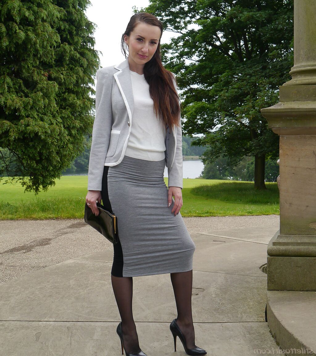 16P Clothed woman Sophia descends park steps in a long skirt and stiletto heels
