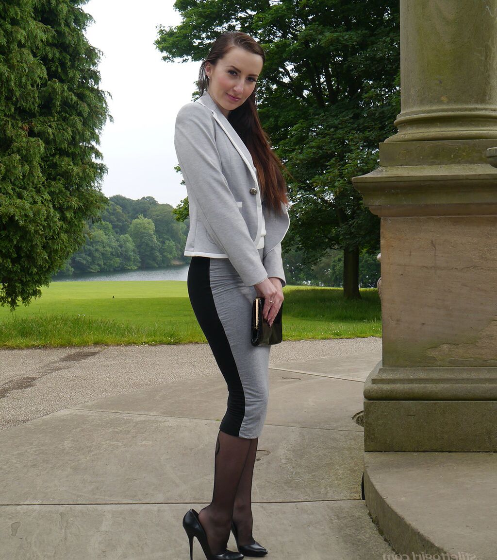 16P Clothed woman Sophia descends park steps in a long skirt and stiletto heels