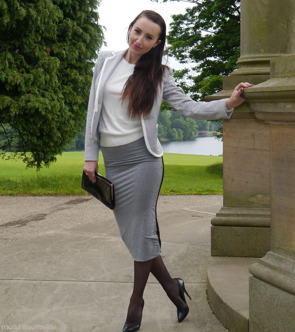 16P Clothed woman Sophia descends park steps in a long skirt and stiletto heels
