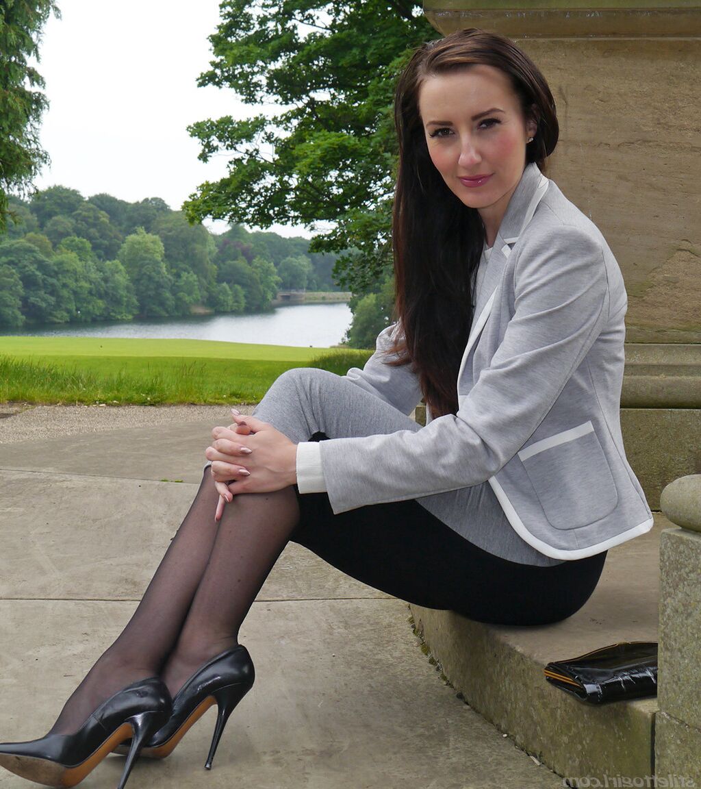 16P Clothed woman Sophia descends park steps in a long skirt and stiletto heels