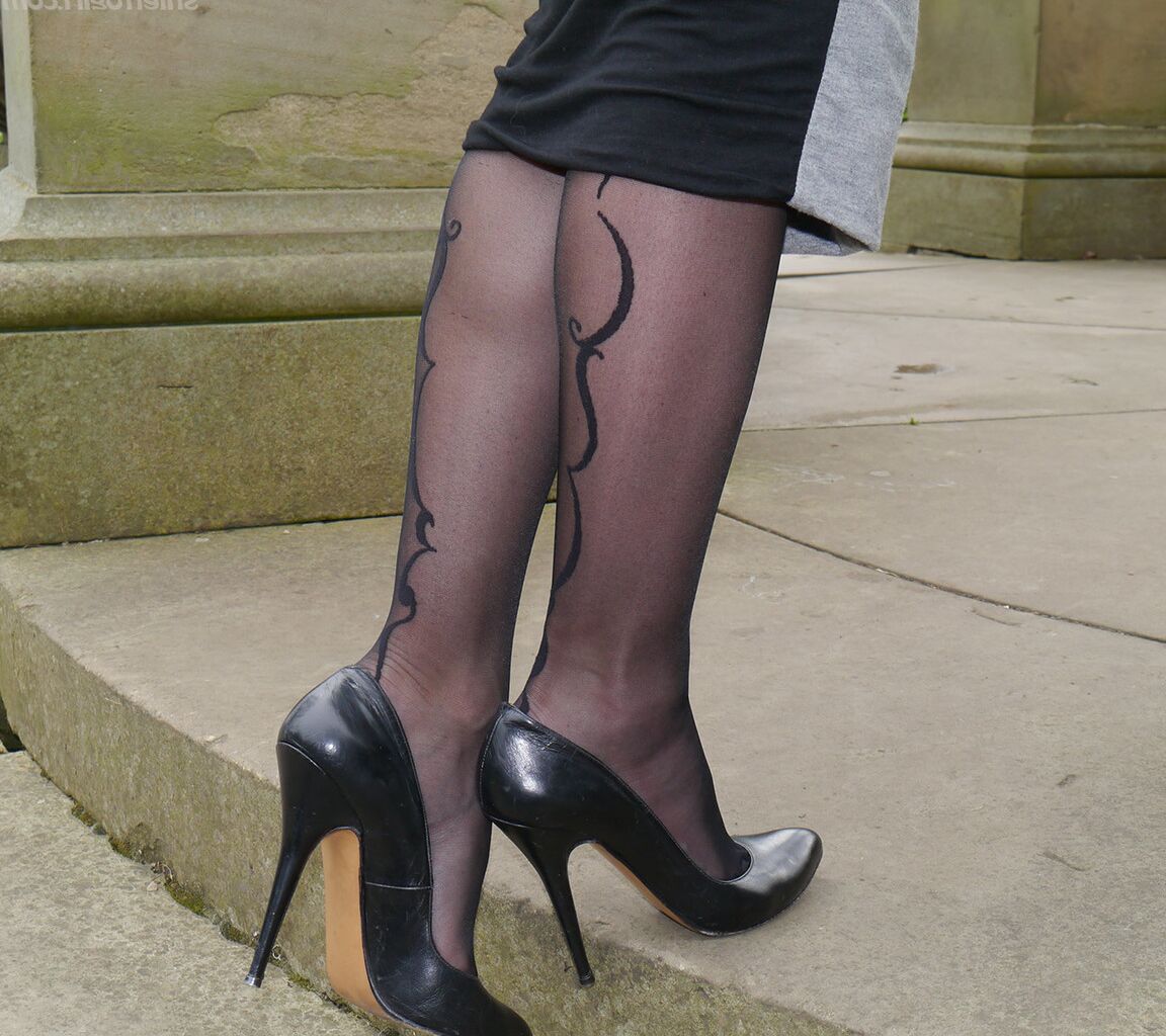 16P Clothed woman Sophia descends park steps in a long skirt and stiletto heels