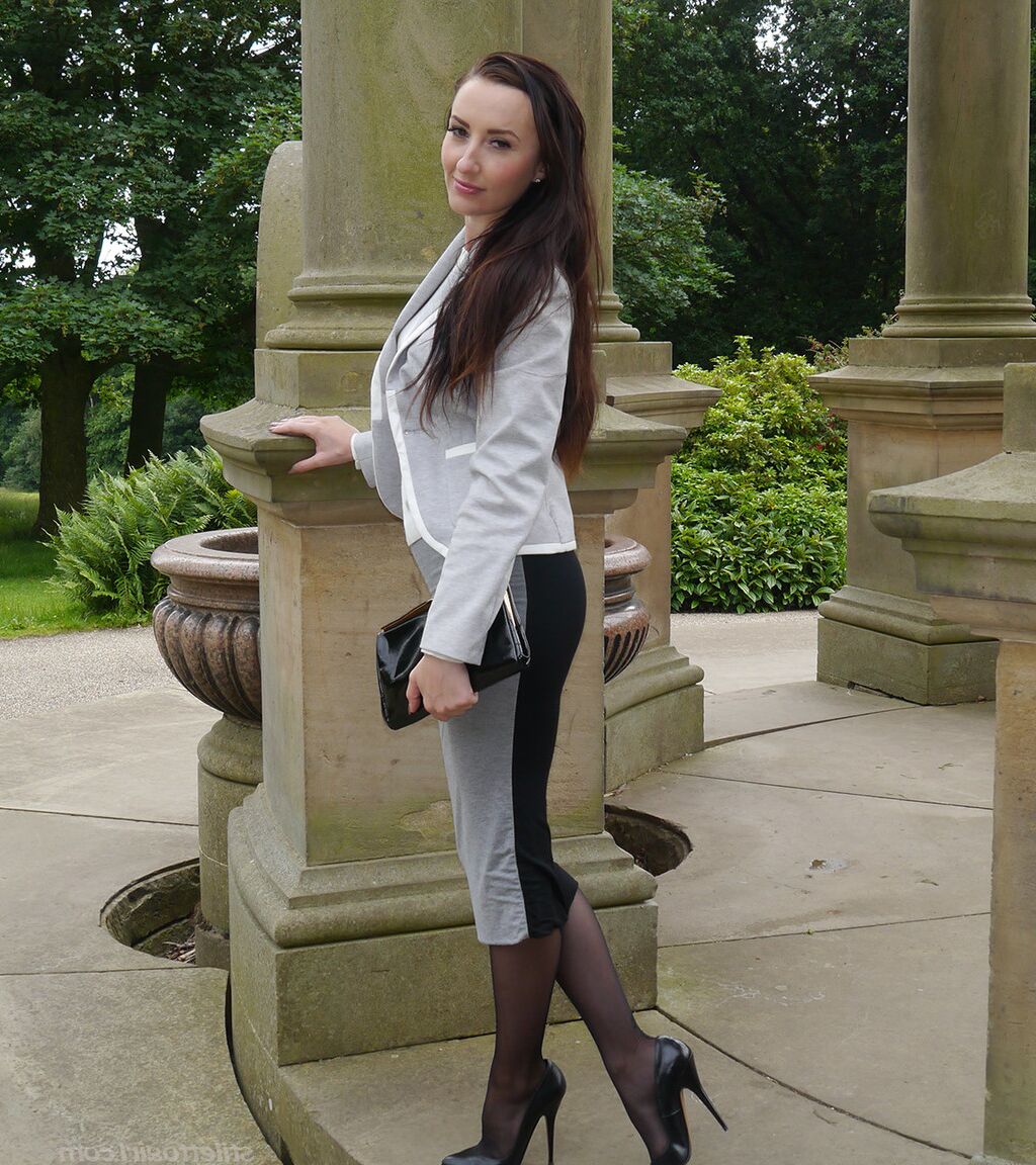 16P Clothed woman Sophia descends park steps in a long skirt and stiletto heels