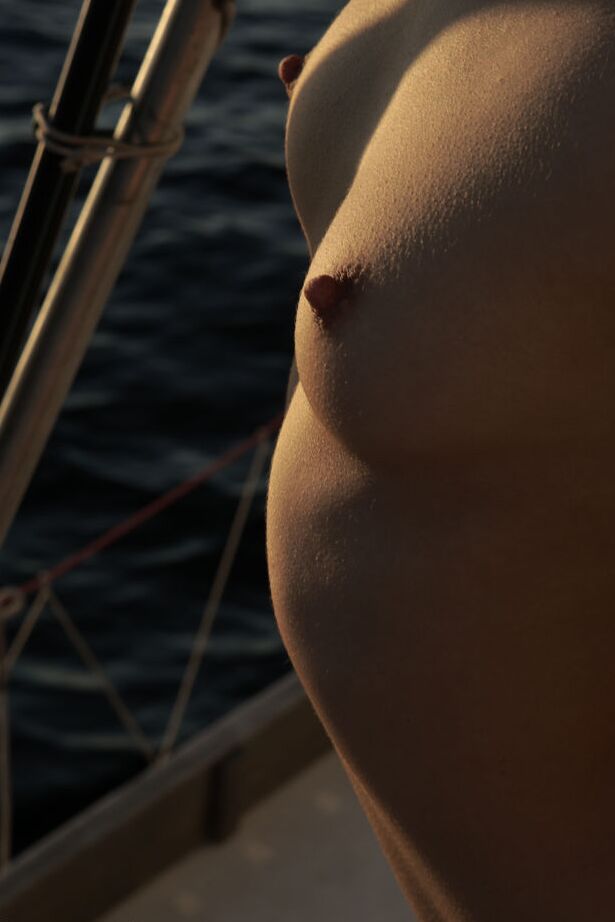 16P Barely legal brunette Roza A poses totally naked against a sail on a sailboat