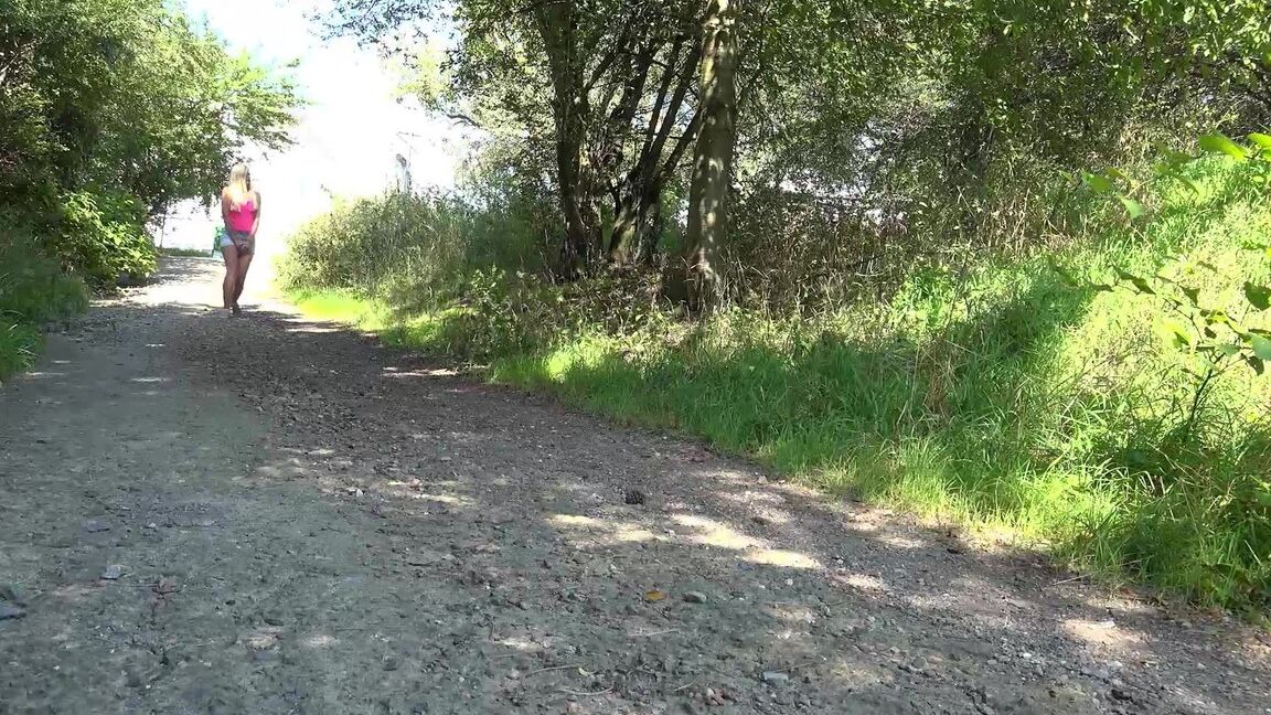 15P Blonde girl Delphine squats for a piss on a gravel path in the country
